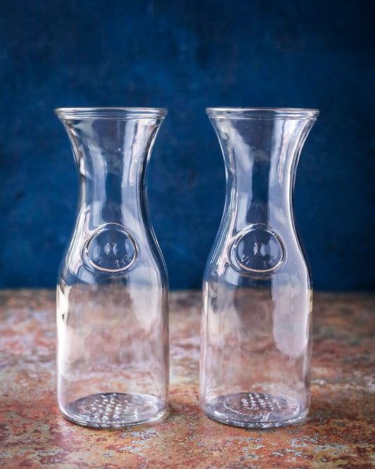 Tris di bottiglie di cristallo per il vino