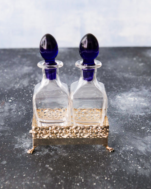 Olio e aceto in cristallo e base argento cassetti