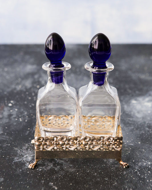 Olio e aceto in cristallo e base argento cassetti